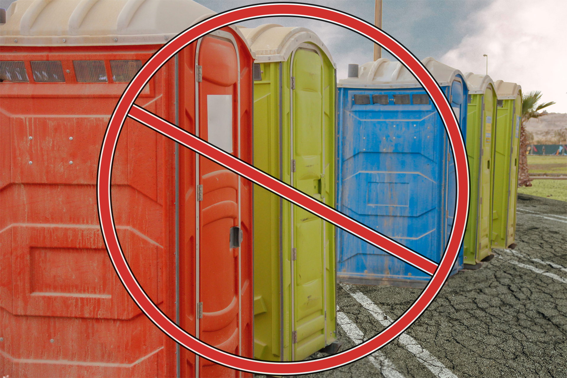 Dirty porta-potties in a parking lot