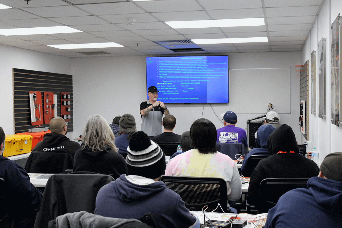 RV technicians participating in a training workshop to improve diagnostic clarity
